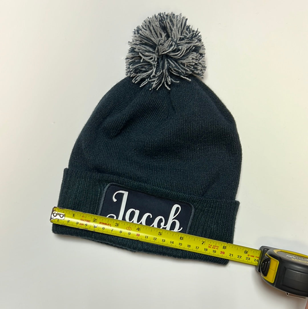 Printers Pom Pom Beanie Hat With Patch